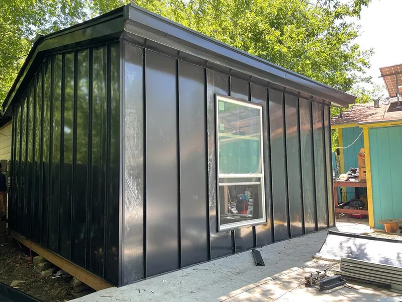 Black standing seam metal wall panels for Roof Inspection in Midland